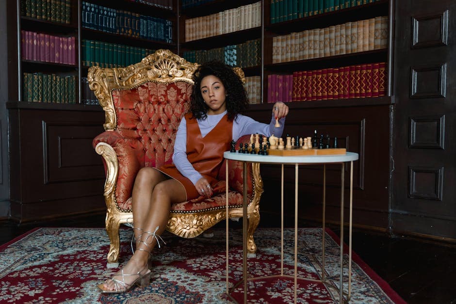 Elegant woman in a vintage armchair playing chess in a classic library. A moment of strategy and reflection.