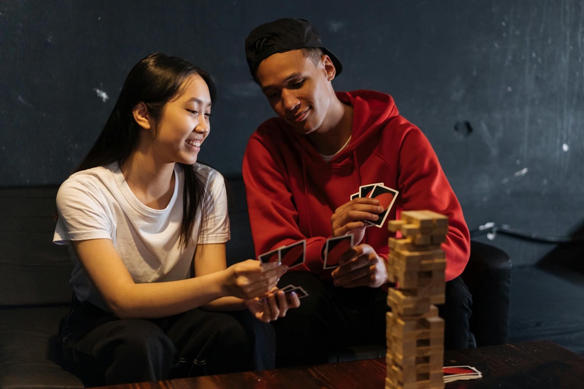 Sophisticated board games setup for adult game night with wine and premium components