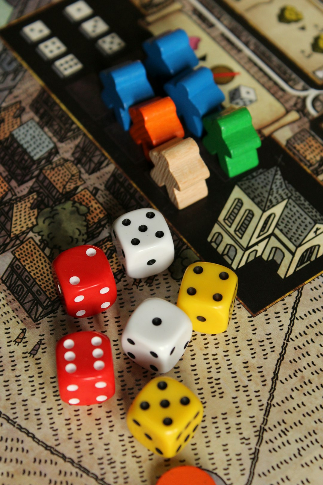 A complex board game mid-session with cards, tokens and resource pieces arranged on the table