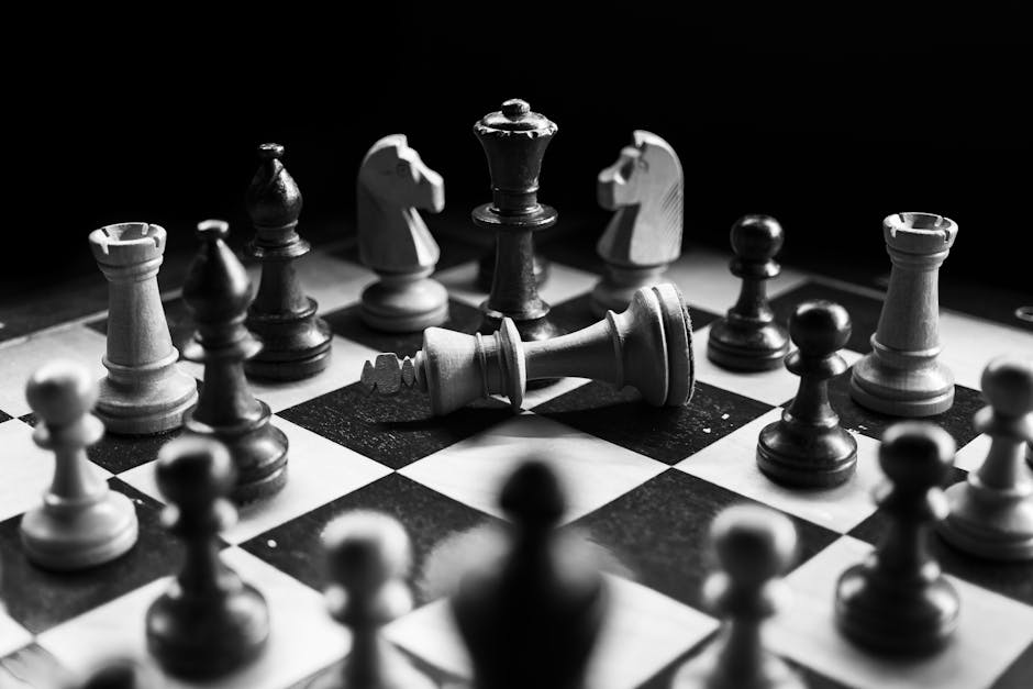 Teenagers deeply engaged in playing a competitive strategy board game together