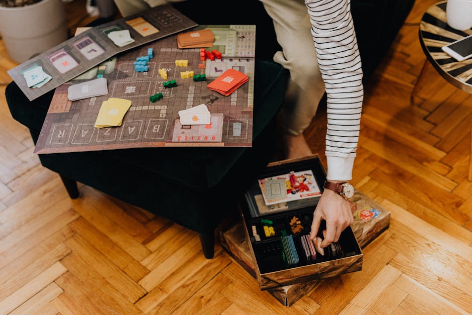 Two people playing a board game at a table