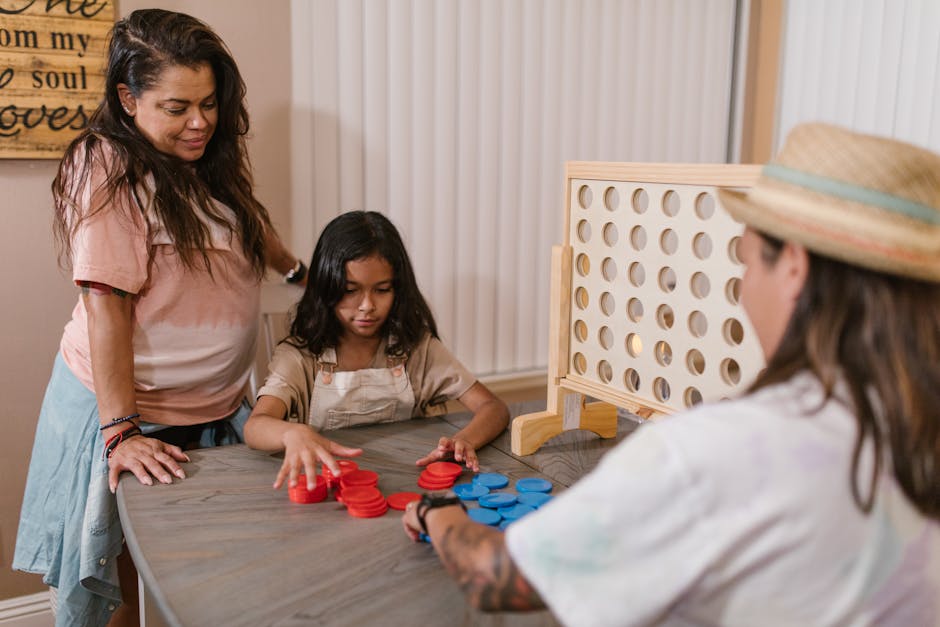 Generation Alpha children playing board games together at a table