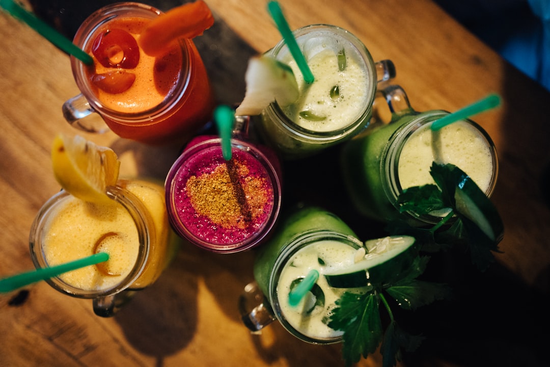 Colourful fresh smoothie drinks lined up, representing the vibrant ingredient choices in Smoothie Wars