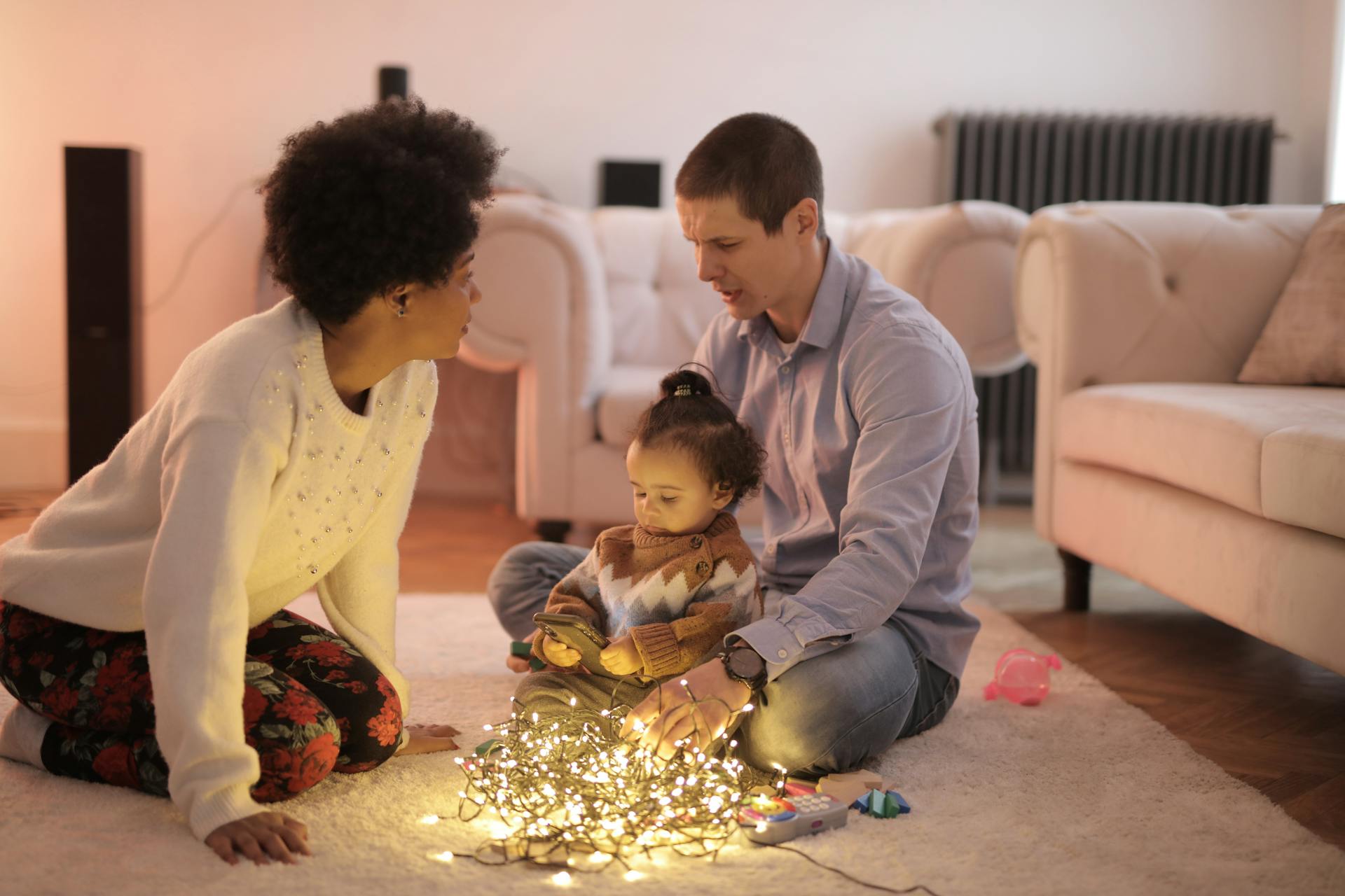 Parent and child engaged in conversation during board game with genuine connection visible